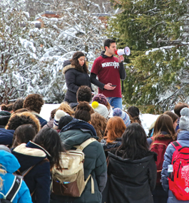 Moll (with megaphone) addresses Brandeis students during the March 2018 walkout to protest gun violence.